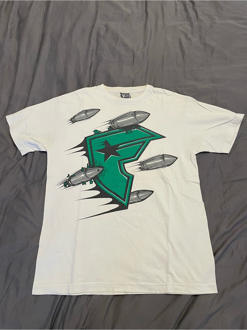 Famous Stars & Straps White Tee with Green Shield and Gray Missile Graphics
